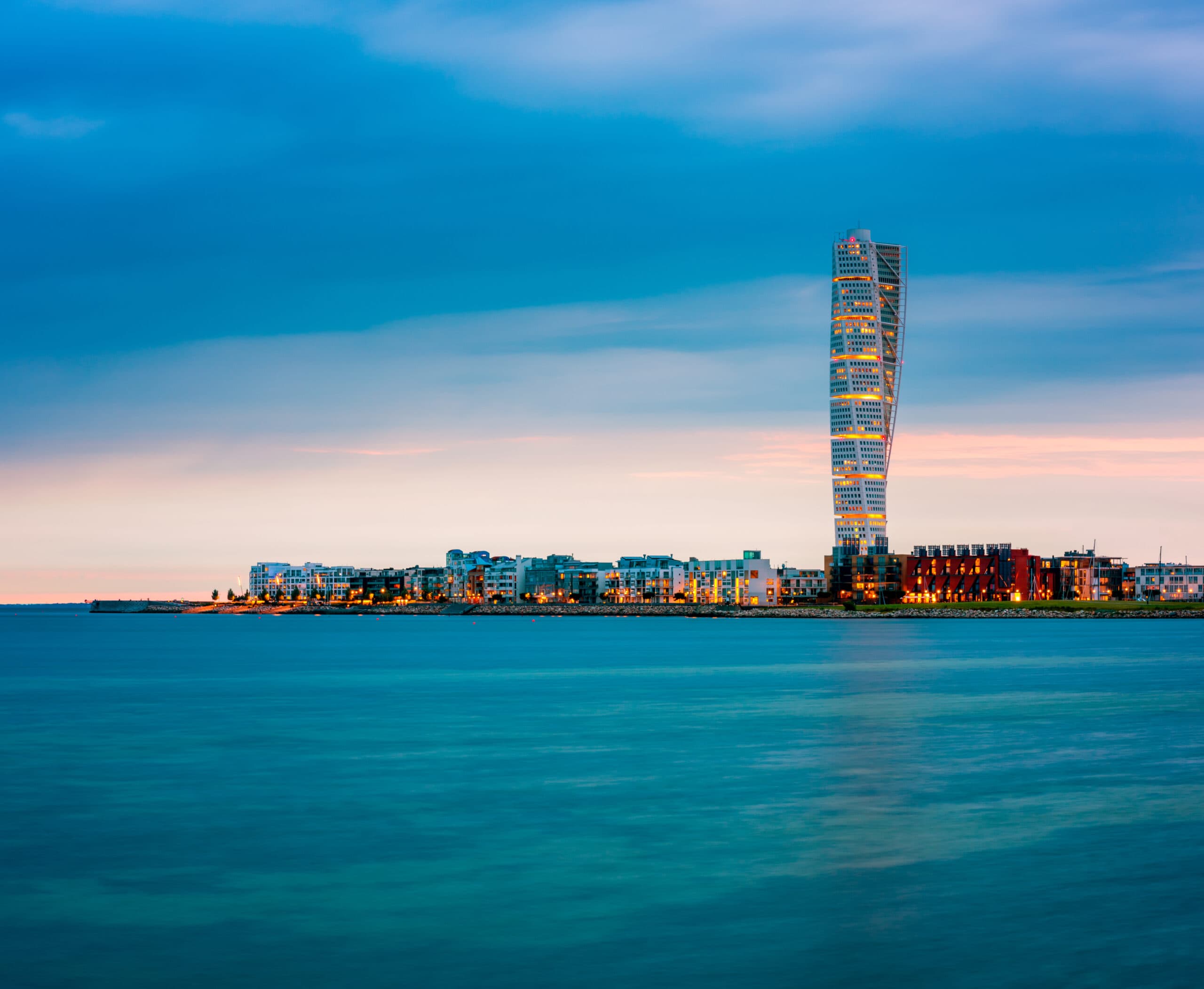 Skyline of Malmo Sweden with Famous Turning Torso Building, captured around sunset.