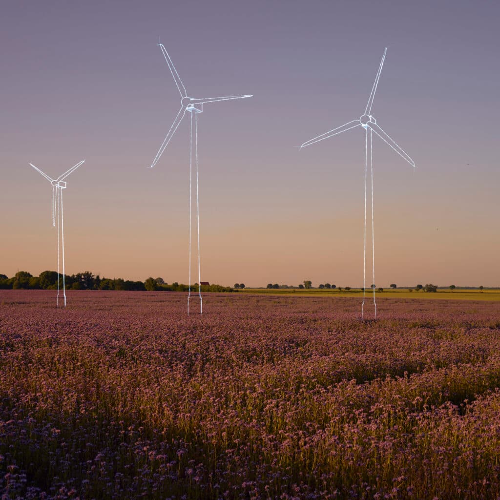 Digital generated image of hand drawn wind turbines overlaid over flower field on sunset. ...