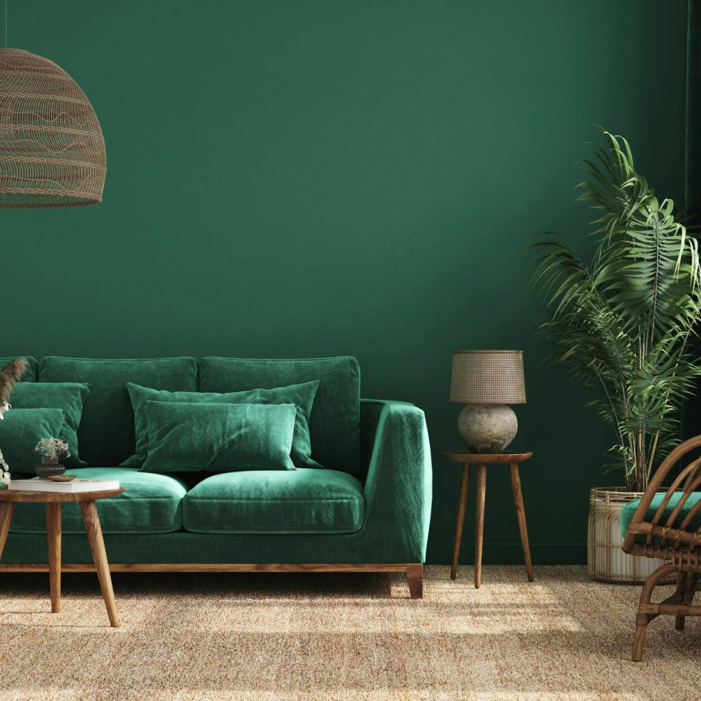 Ett mysigt vardagsrum med en grön soffa.