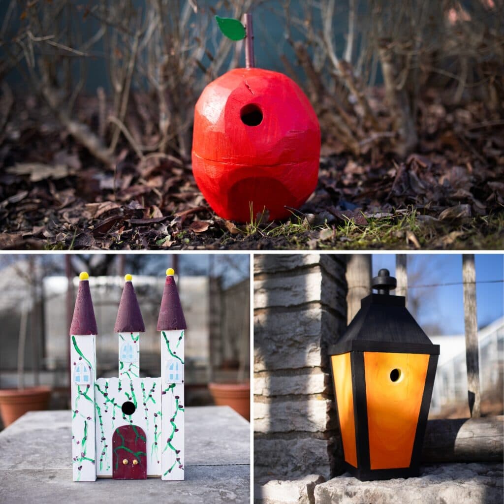 Fågelholkar i form av ett rött äpple, ett vitt slott med tre torn, och en svart lykta med gult sken. ...